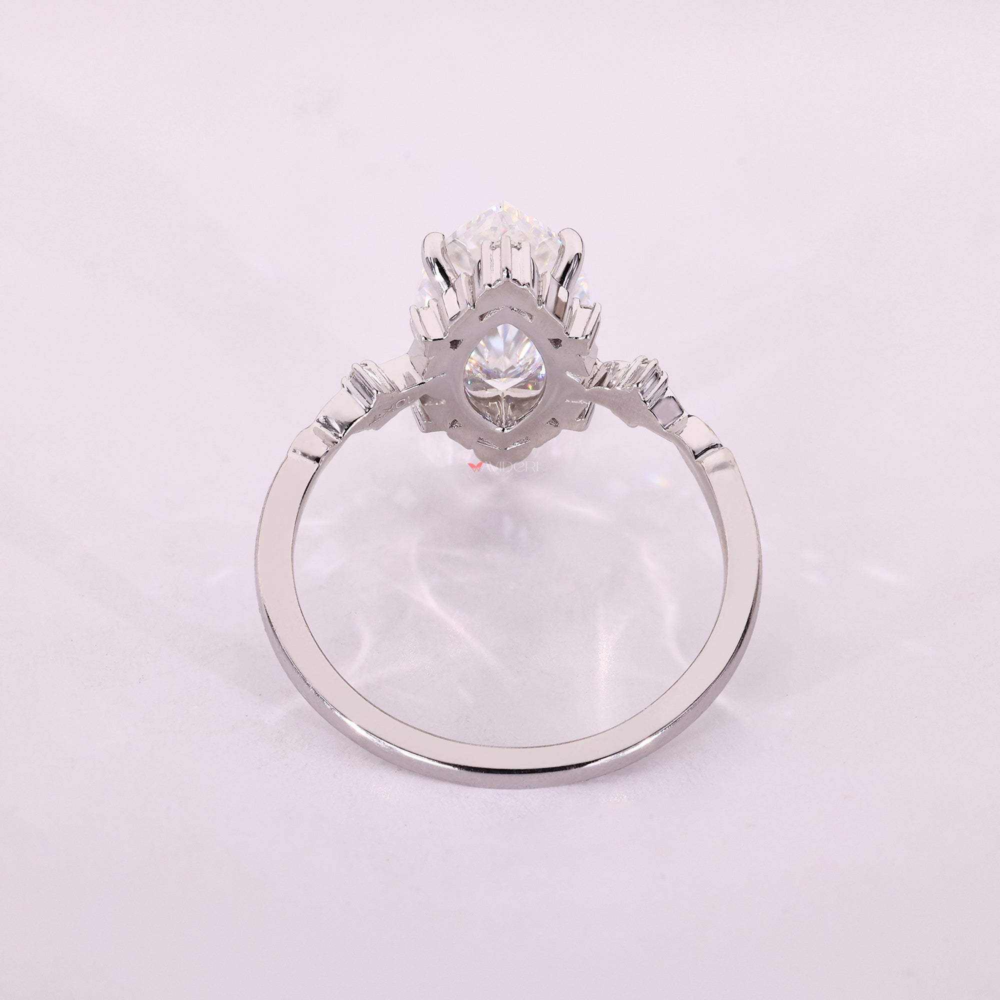 White gold moissanite ring made with smooth handcrafted quality.