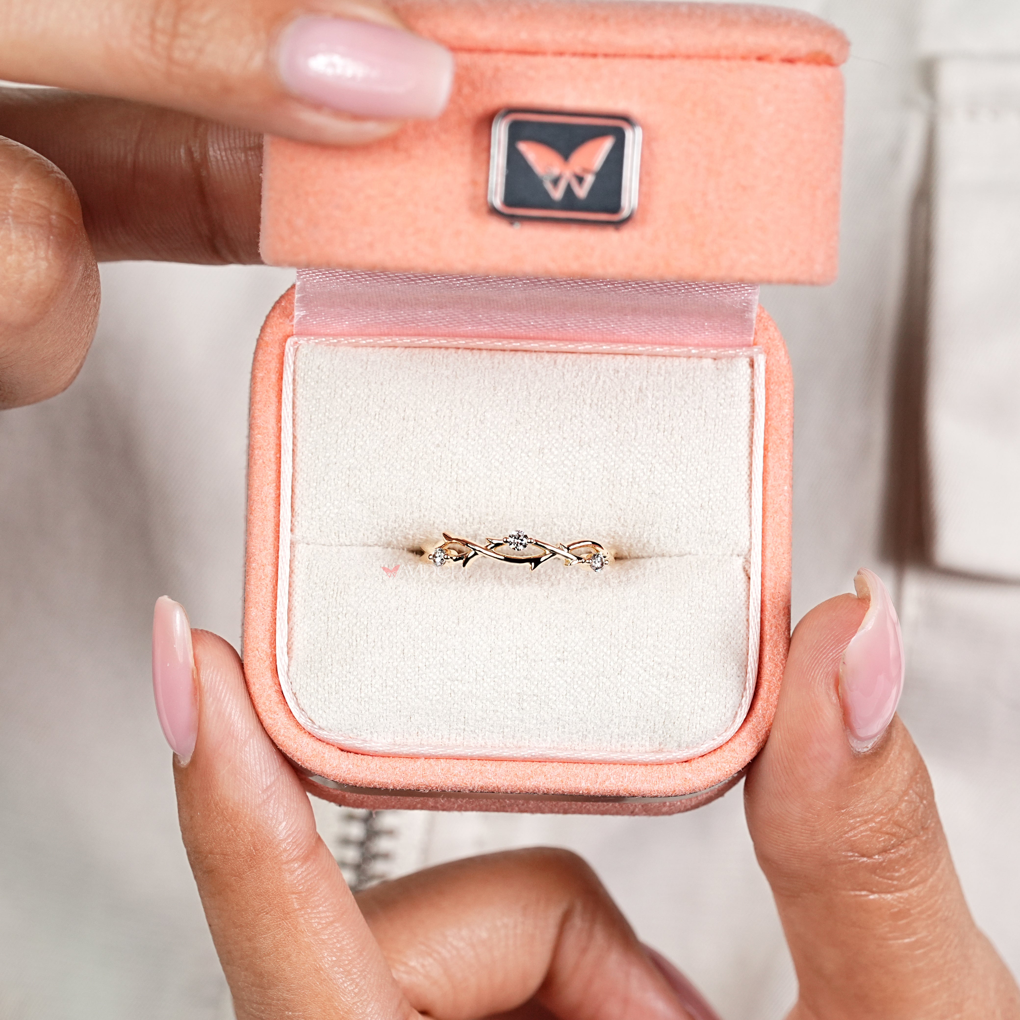 Nature inspired twisted band with handcrafted round diamonds
