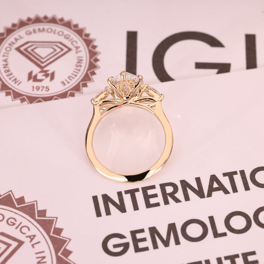 Handmade marquise center diamond ring with side stones.
