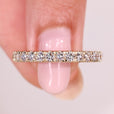 Round diamond half eternity band with prong setting.
