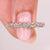 Round diamond half eternity band with prong setting.
