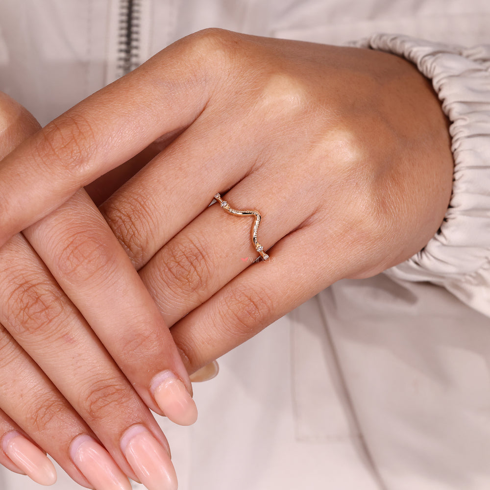 Avideri curved diamond wedding band.
