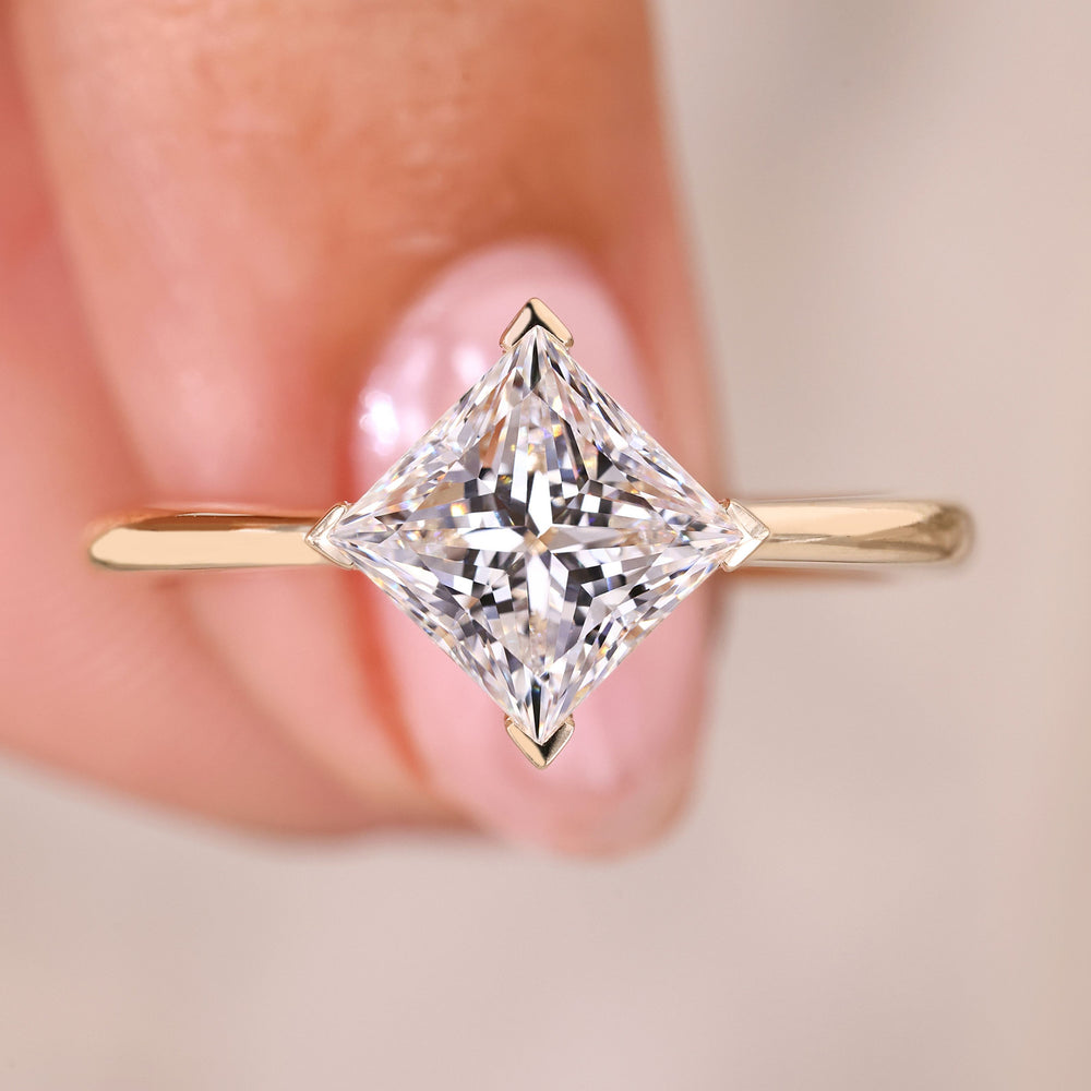 Princess cut diamond ring solitaire v prong style.
