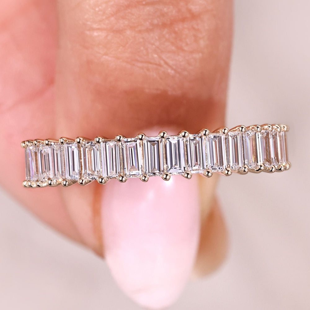 Half eternity diamond band prong set design.
