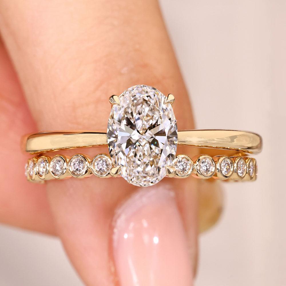 Curved wedding band with pave moissanite.
