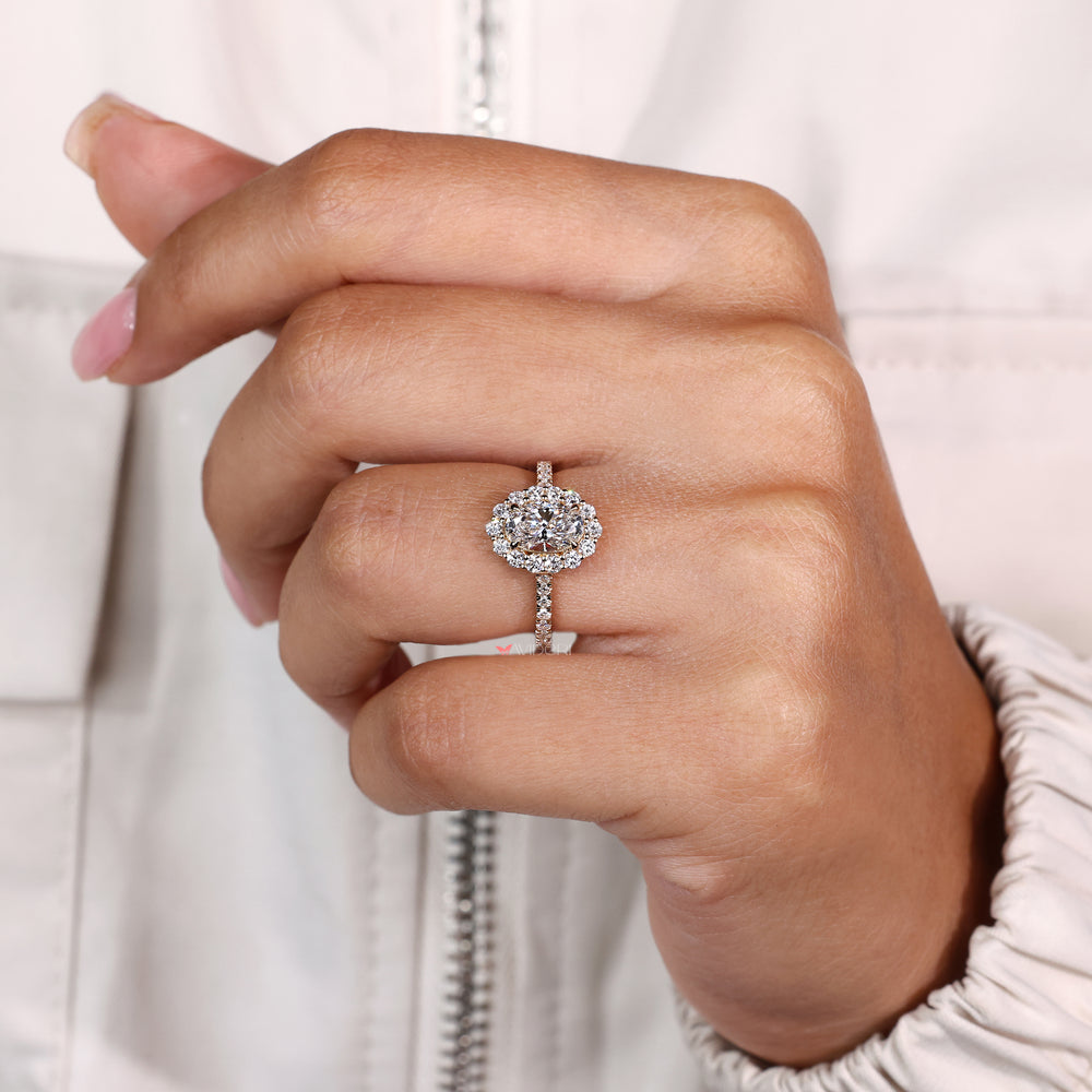 Handmade oval diamond ring with round halo accents
