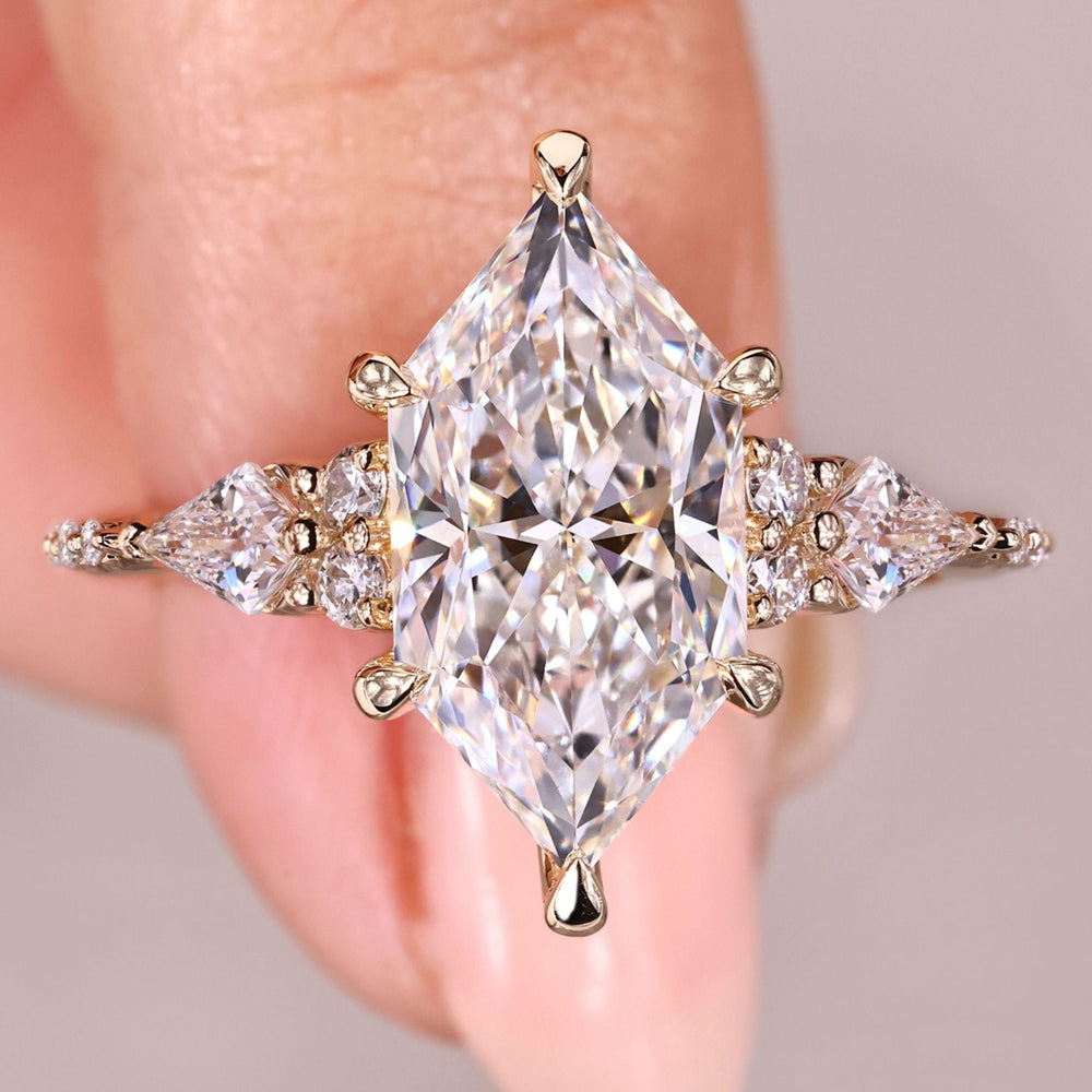 Vintage engagement ring with marquise cut moissanite halo.
