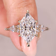 Vintage engagement ring with marquise cut moissanite halo.
