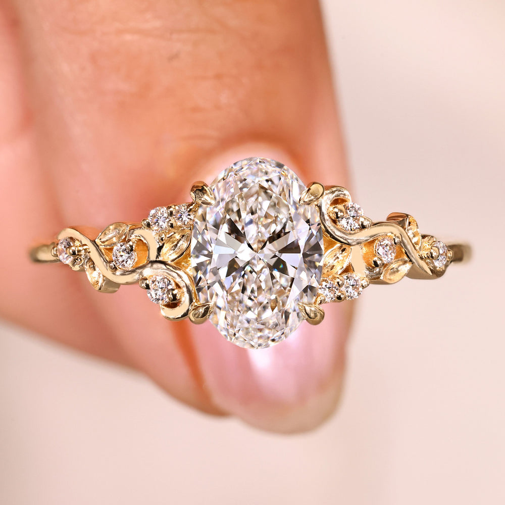 Oval cut diamond ring with round side stones.
