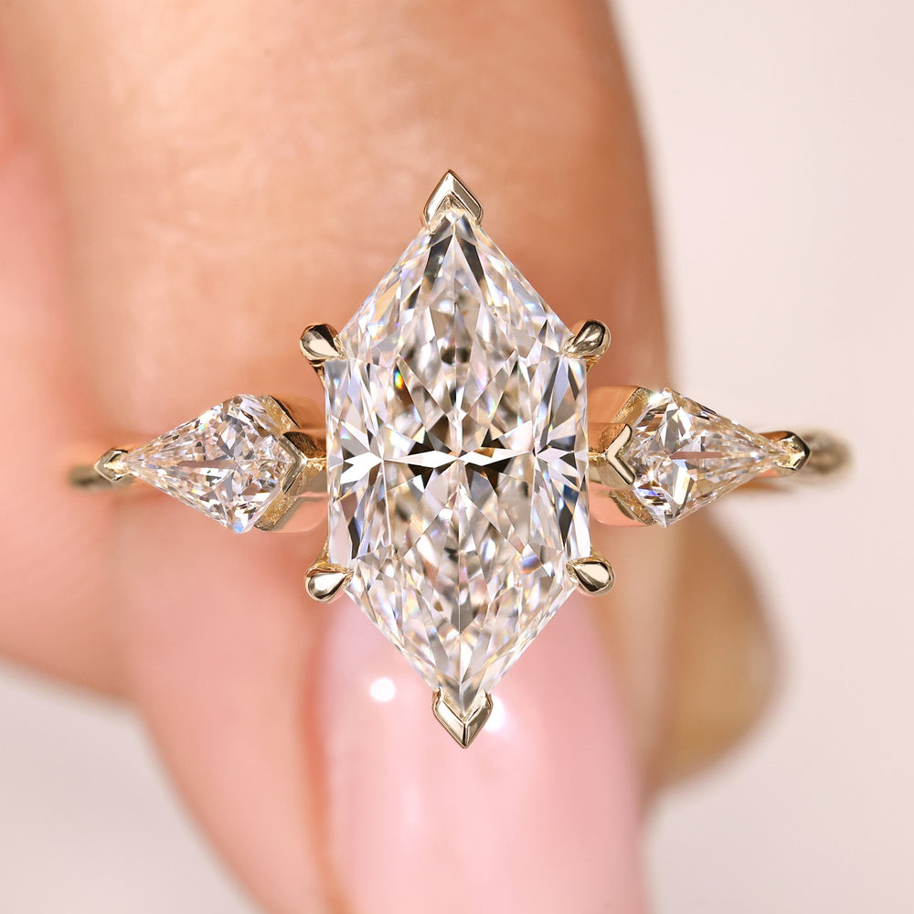 Dutch marquise diamond ring with kite cut side stones design
