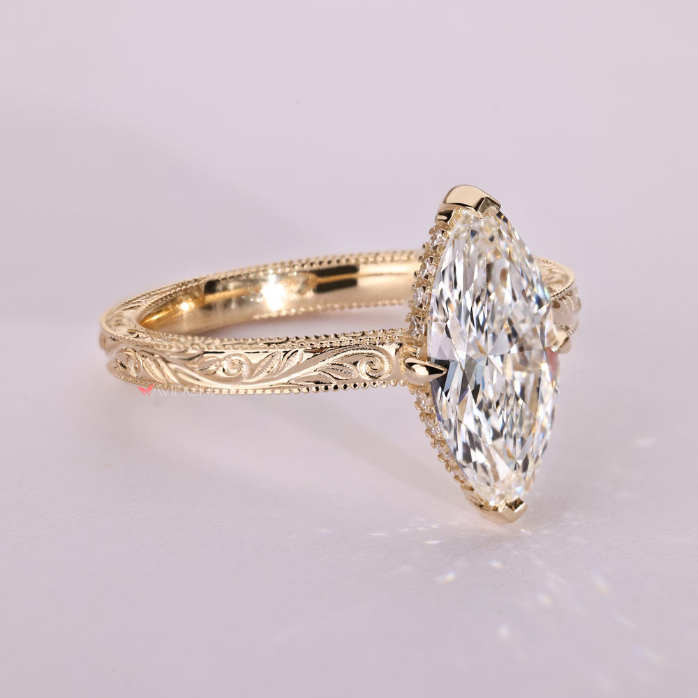 Handmade marquise ring with hidden round diamond halo.
