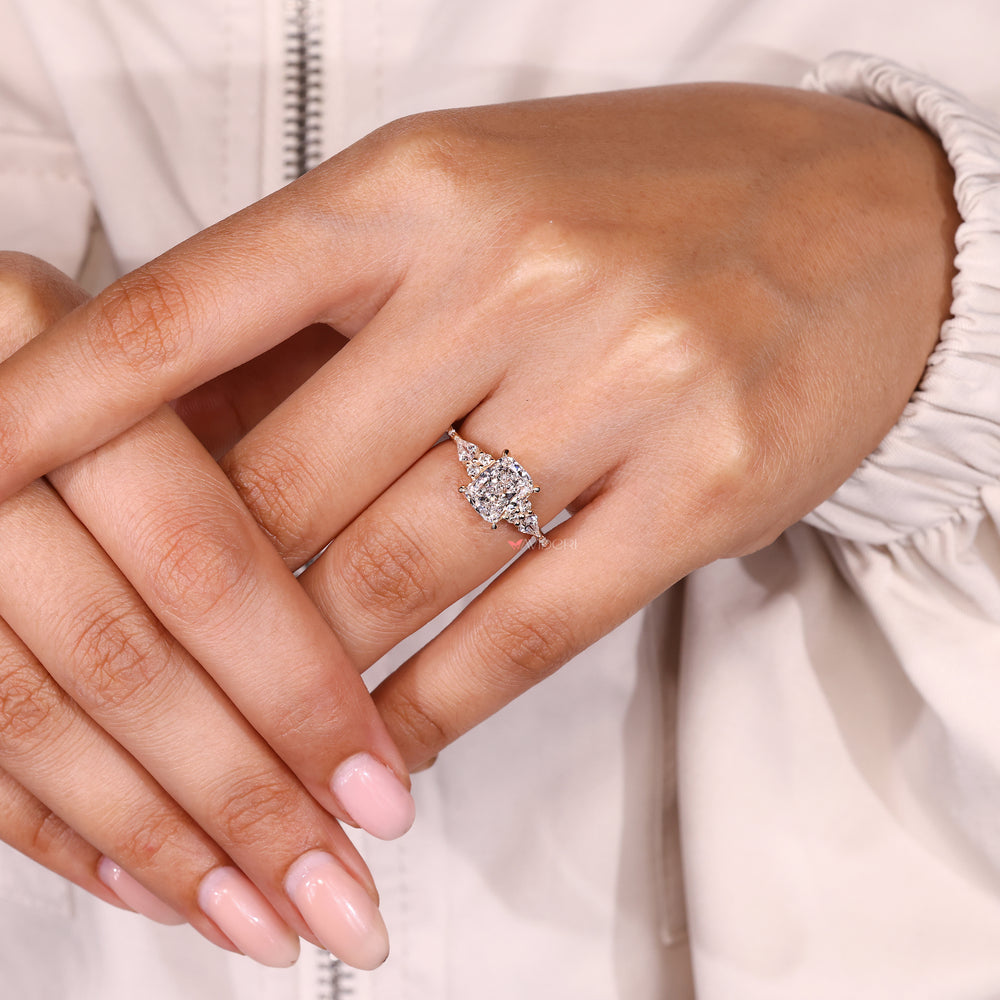 IGI certified cushion cut ring with side stone design.
