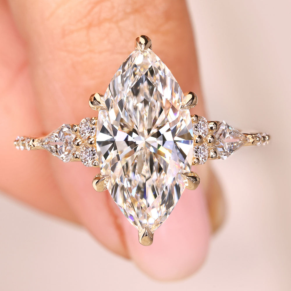 Marquise lab grown diamond ring with kite side stones.
