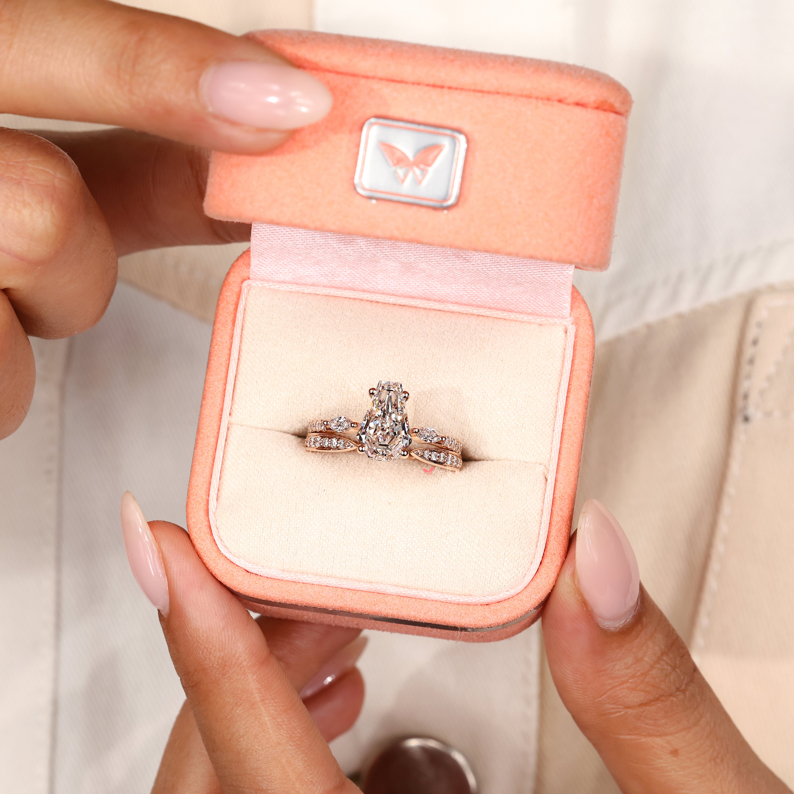 Open gap band with coffin diamond engagement ring.
