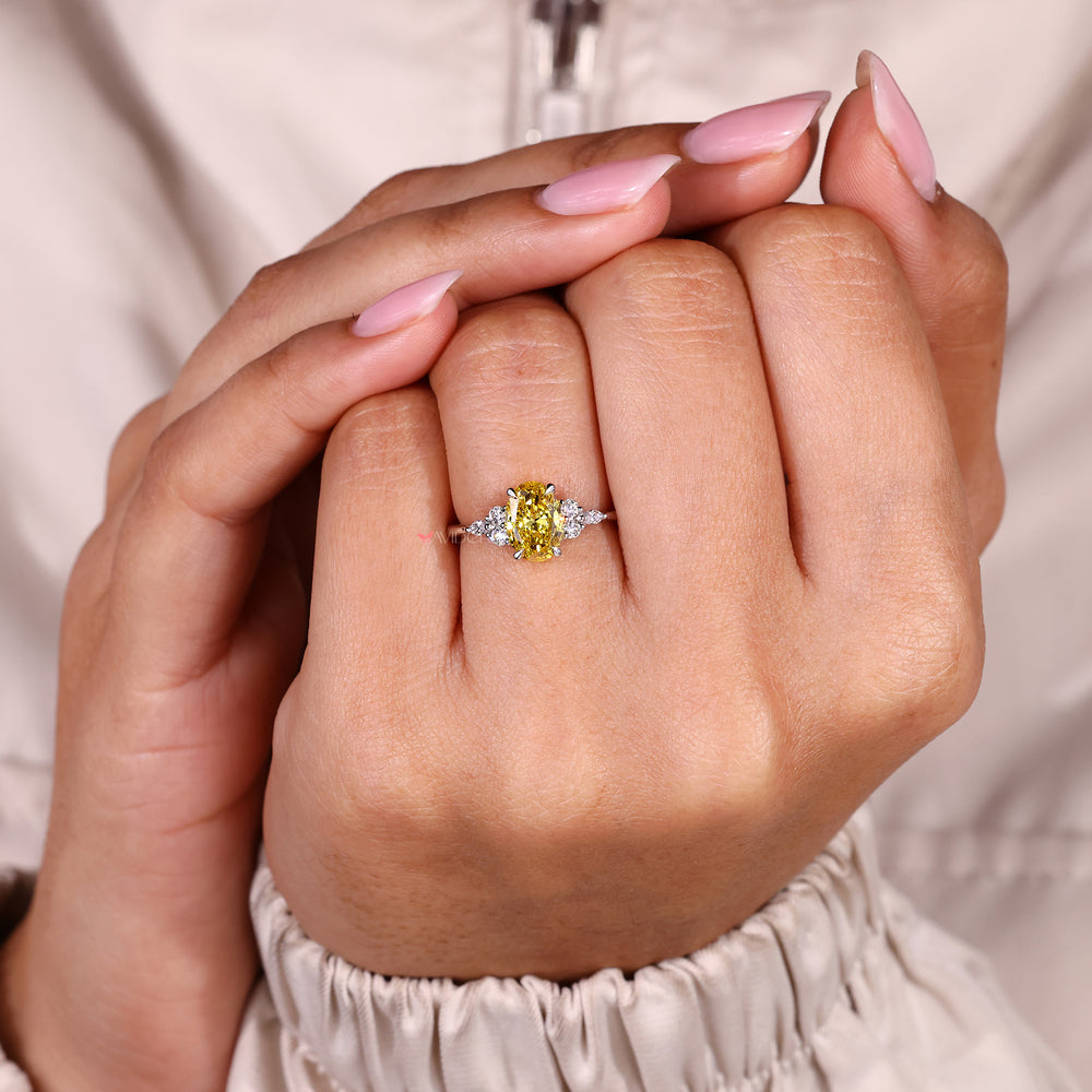 Handmade oval cut yellow diamond ring muse setting.