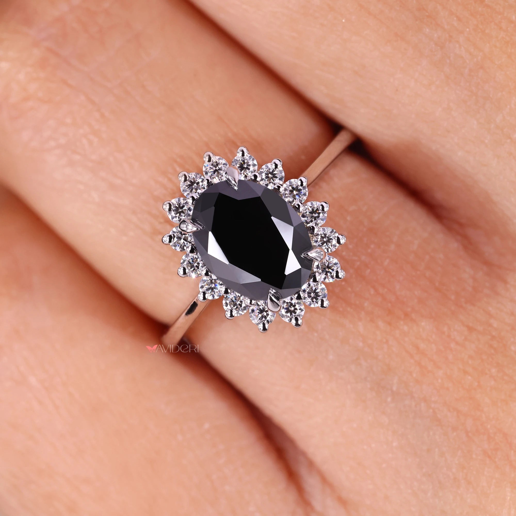 Black moissanite ring set in white gold engagement ring.