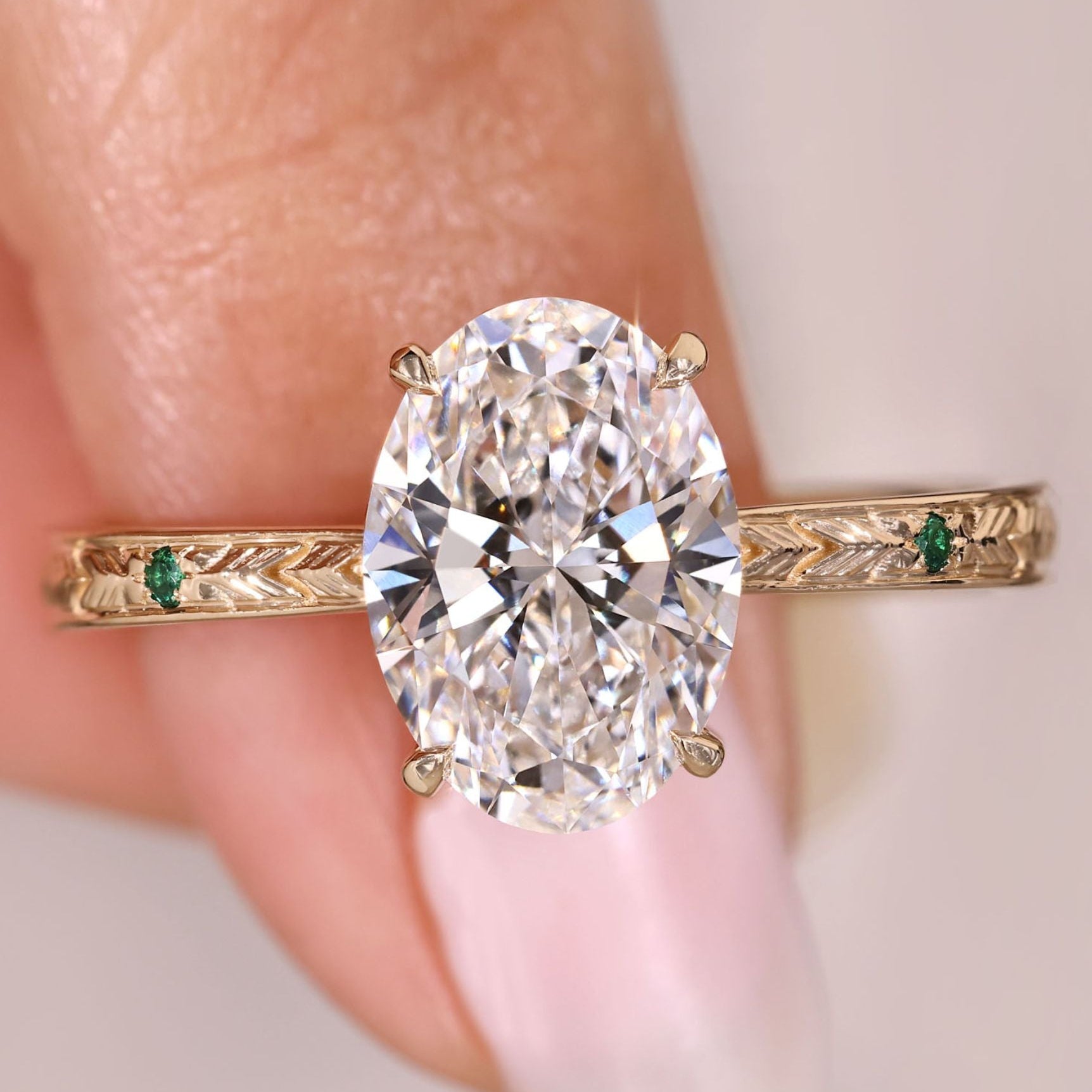 Oval cut diamond ring with hidden halo design.
