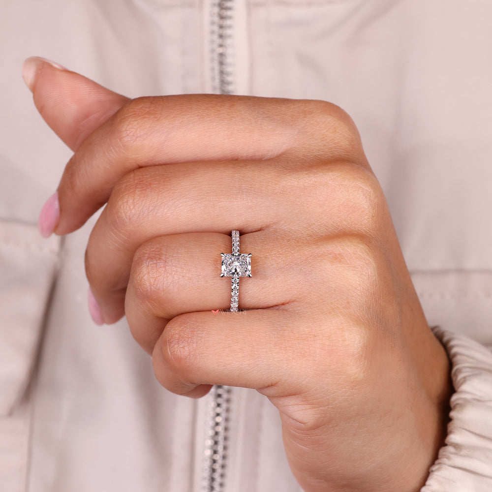 Handmade radiant cut diamond ring with cathedral style.