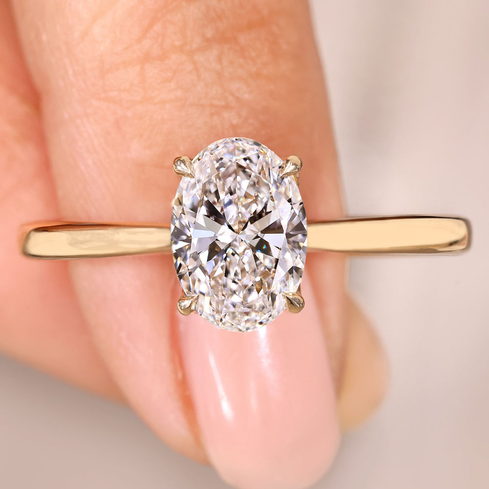 Oval cut diamond ring hidden halo style.
