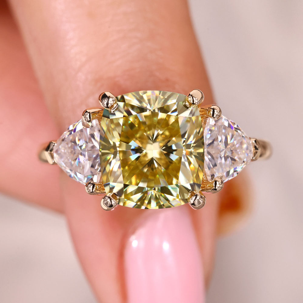 Cushion cut moissanite three stone ring with trillion sides.
