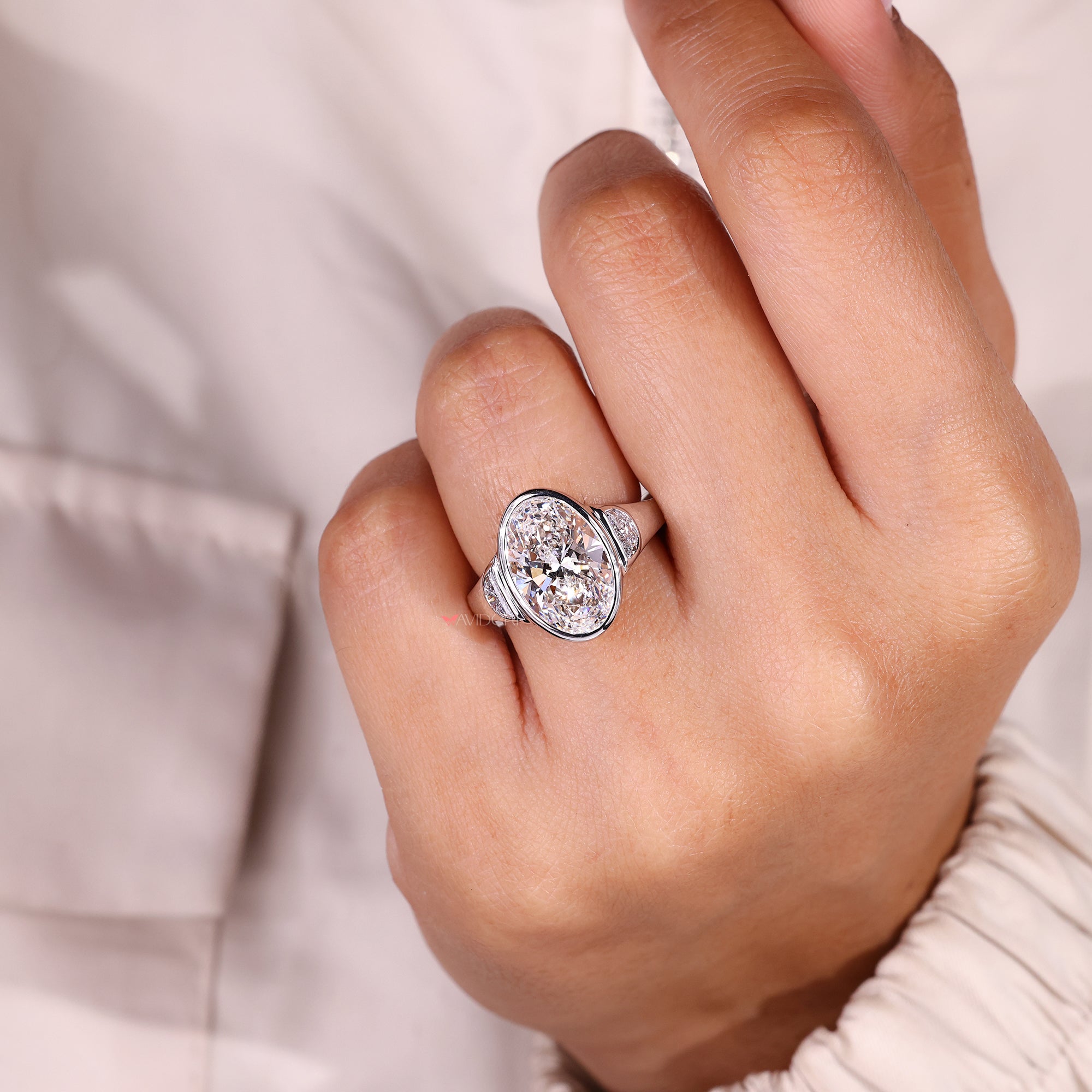 Handmade three stone engagement ring in white gold.