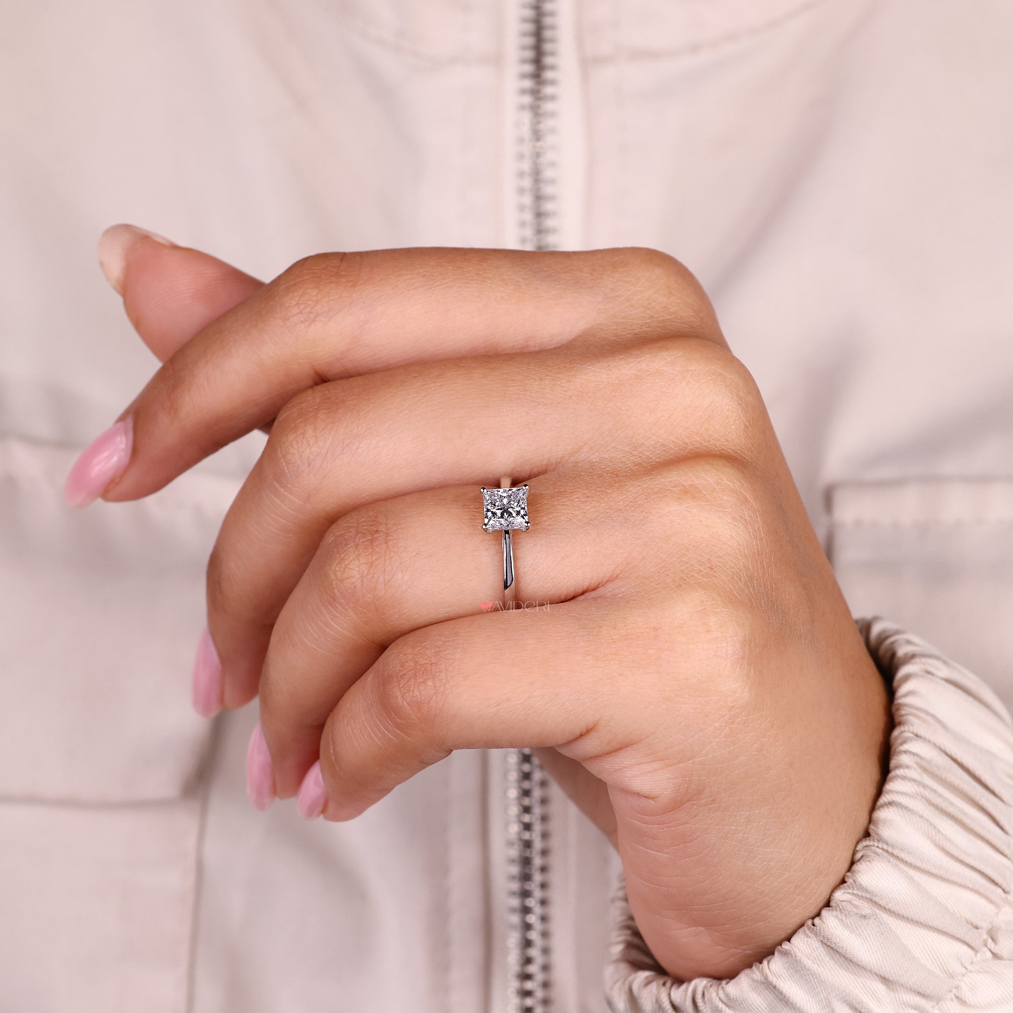 IGI certified princess cut diamond ring with four prong setting.
