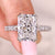 Radiant cut diamond ring with pave setting band.
