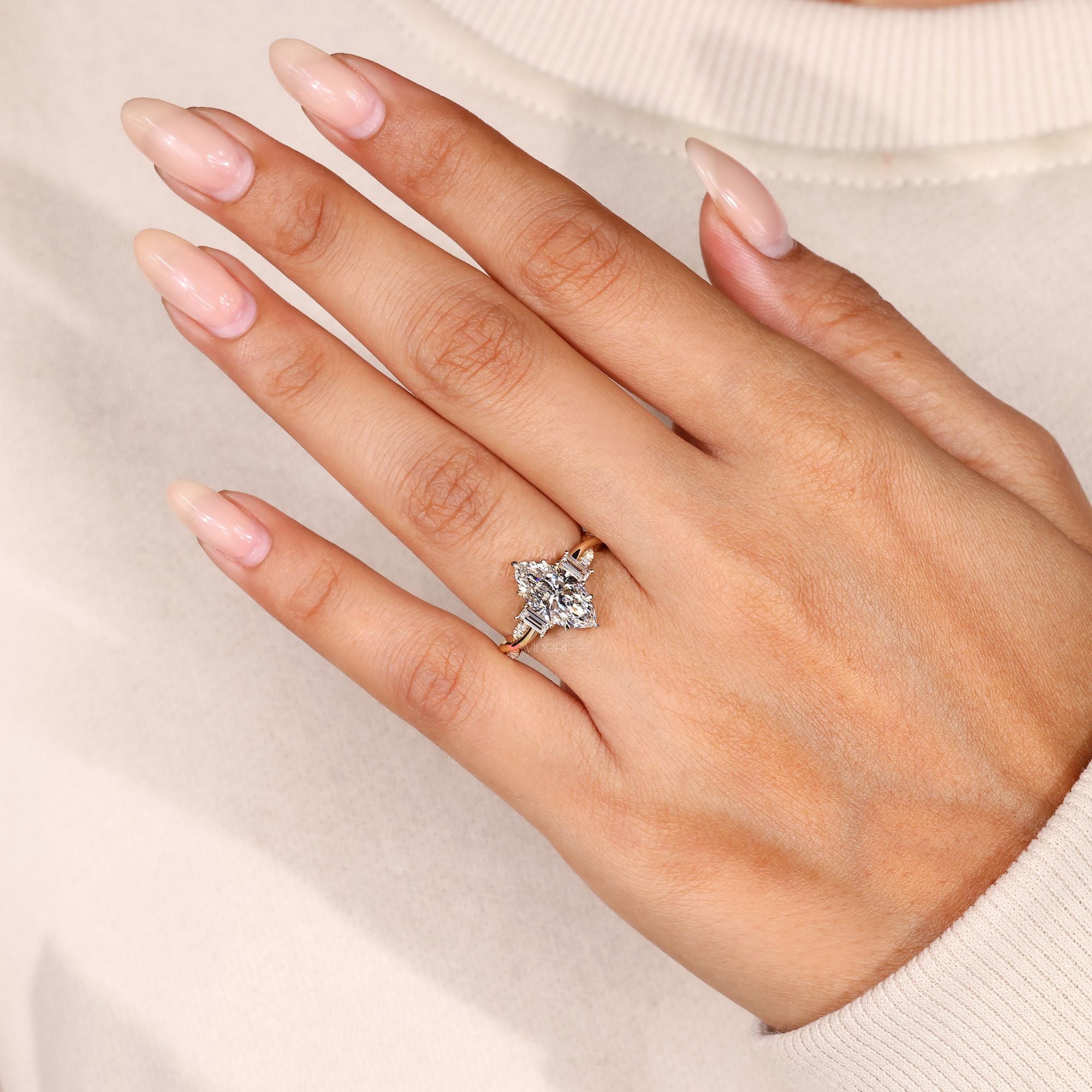 Marquise ring with baguette and round diamonds.
