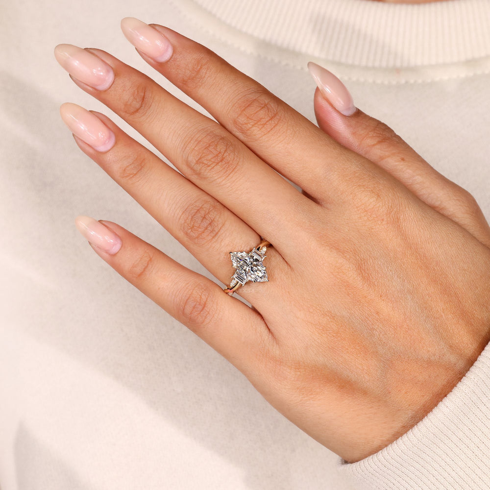 Marquise ring with baguette and round diamonds.
