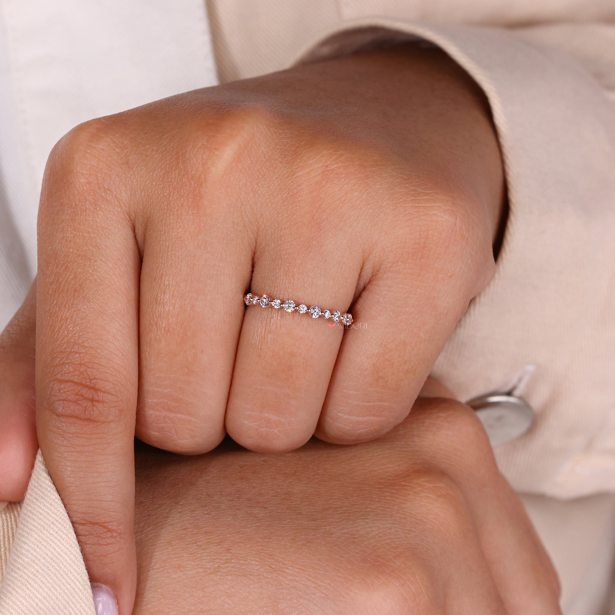 Avideri band with a round diamond eternity band for luxurious sparkle.
