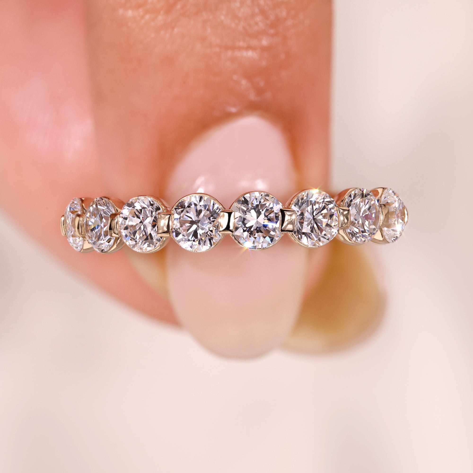 Diamond wedding band in shared prong eternity band.