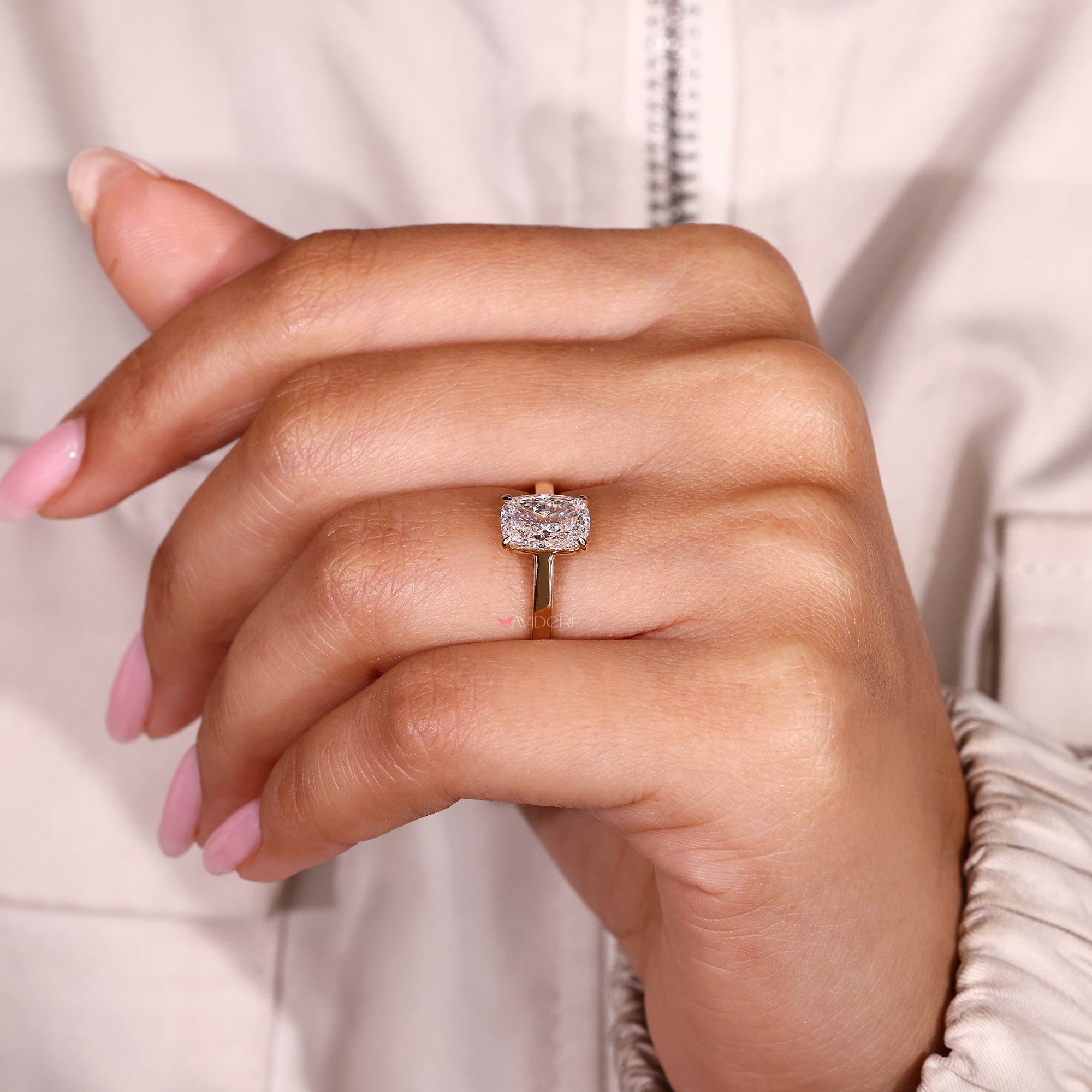 Lab grown cushion cut diamond solitaire ring.