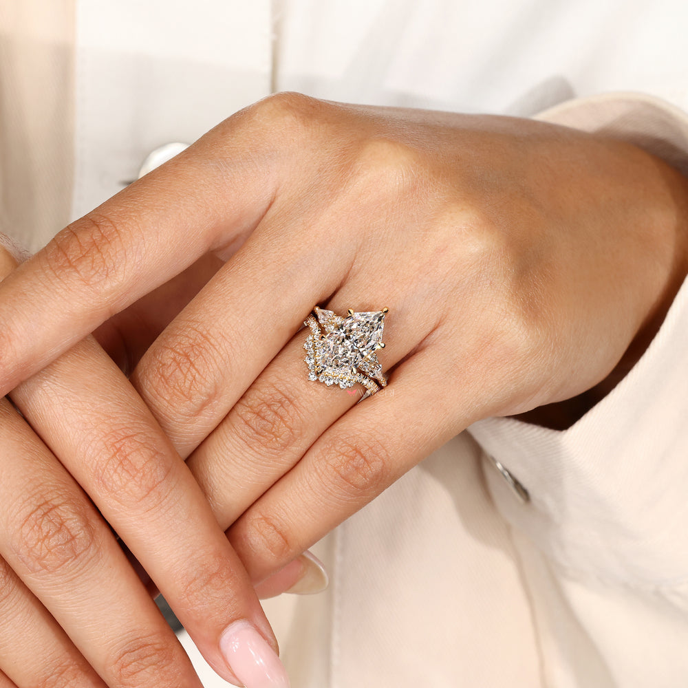 Handmade marquise engagement ring with curved band.
