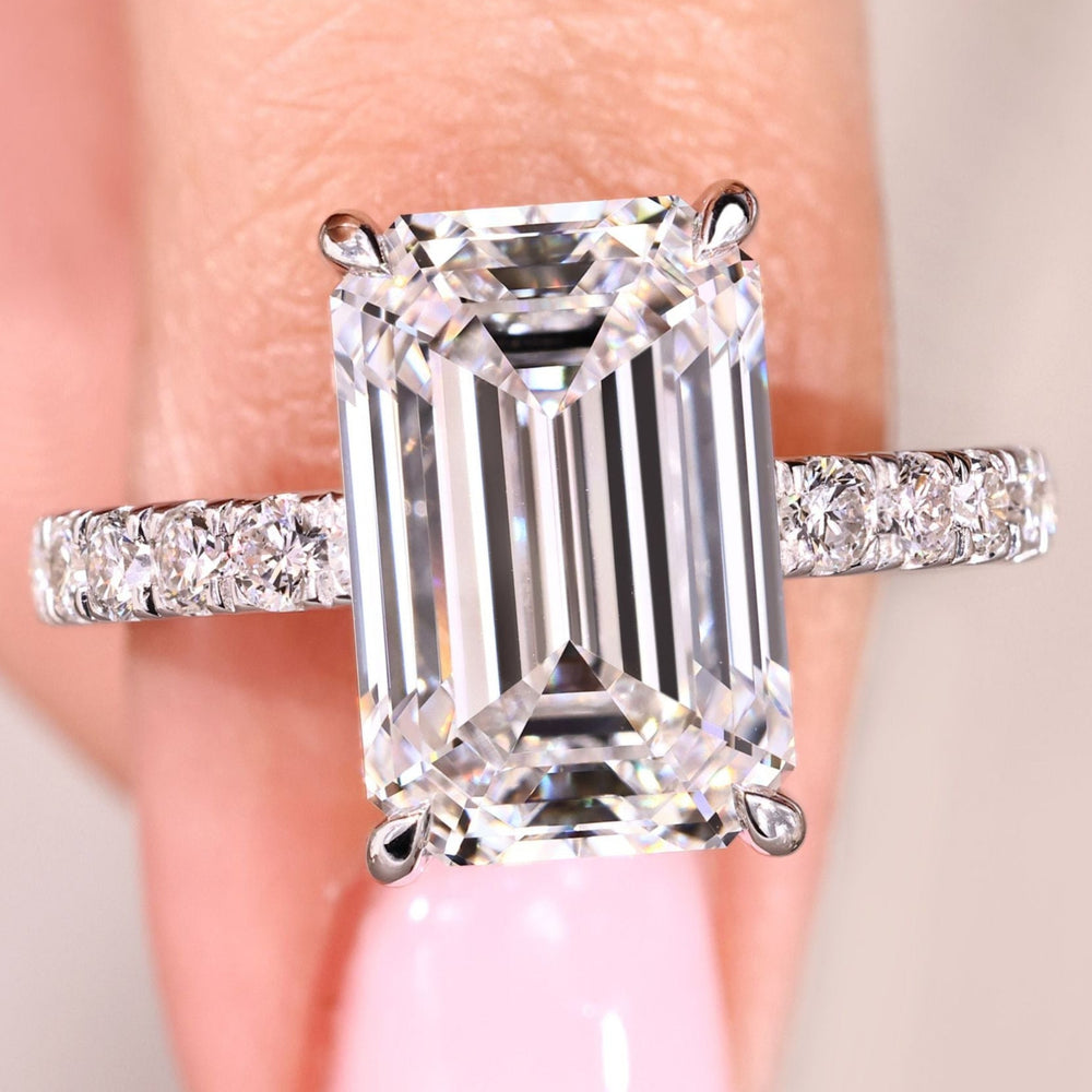 Avideri emerald cut diamond ring with pave setting.
