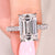 Avideri emerald cut diamond ring with pave setting.
