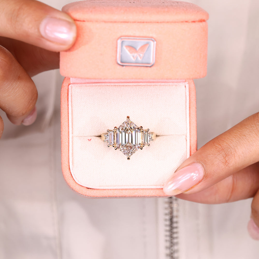 Hexagon ring with round and baguette side stones.
