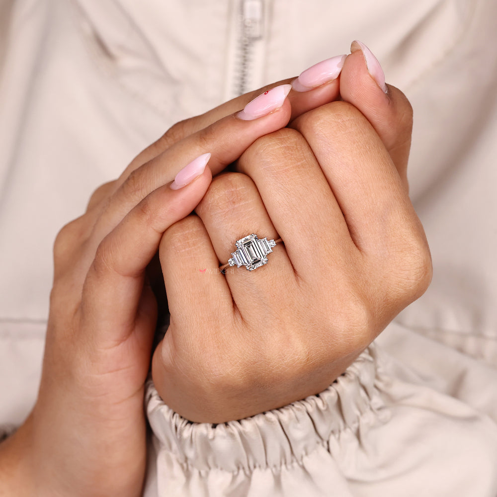 Five stone diamond ring with tapered shank design.
