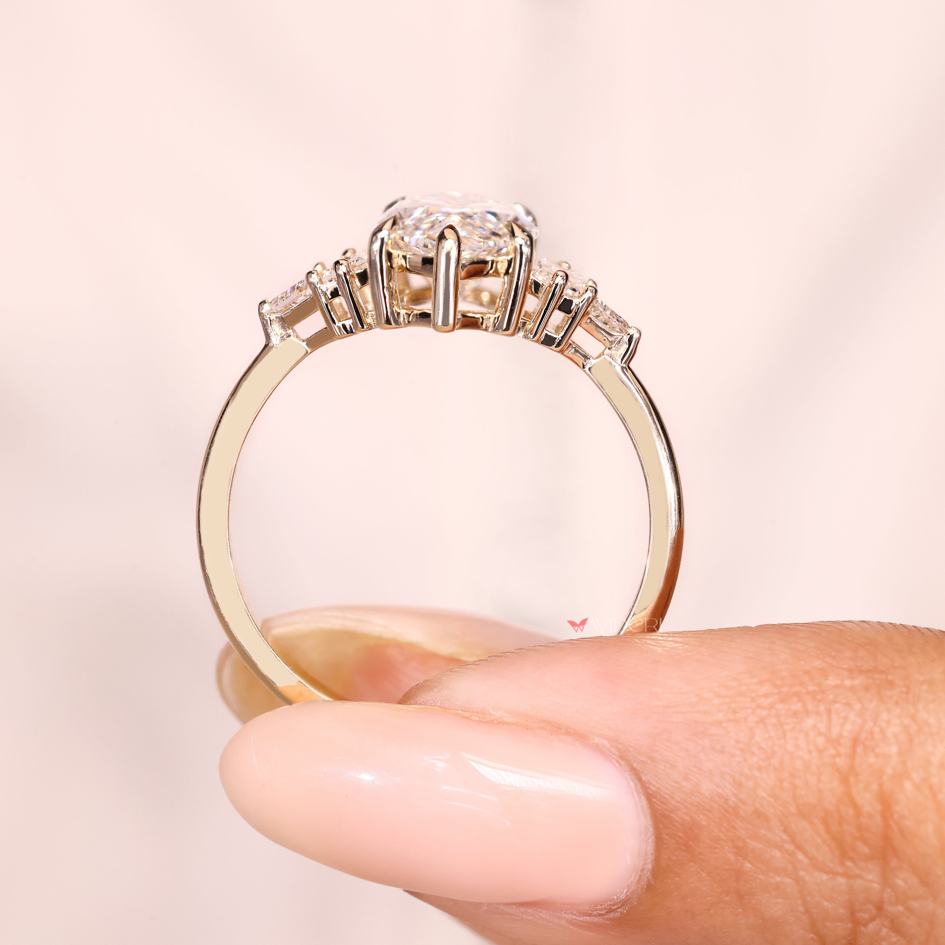Marquise lab diamond ring with six claw prong design.
