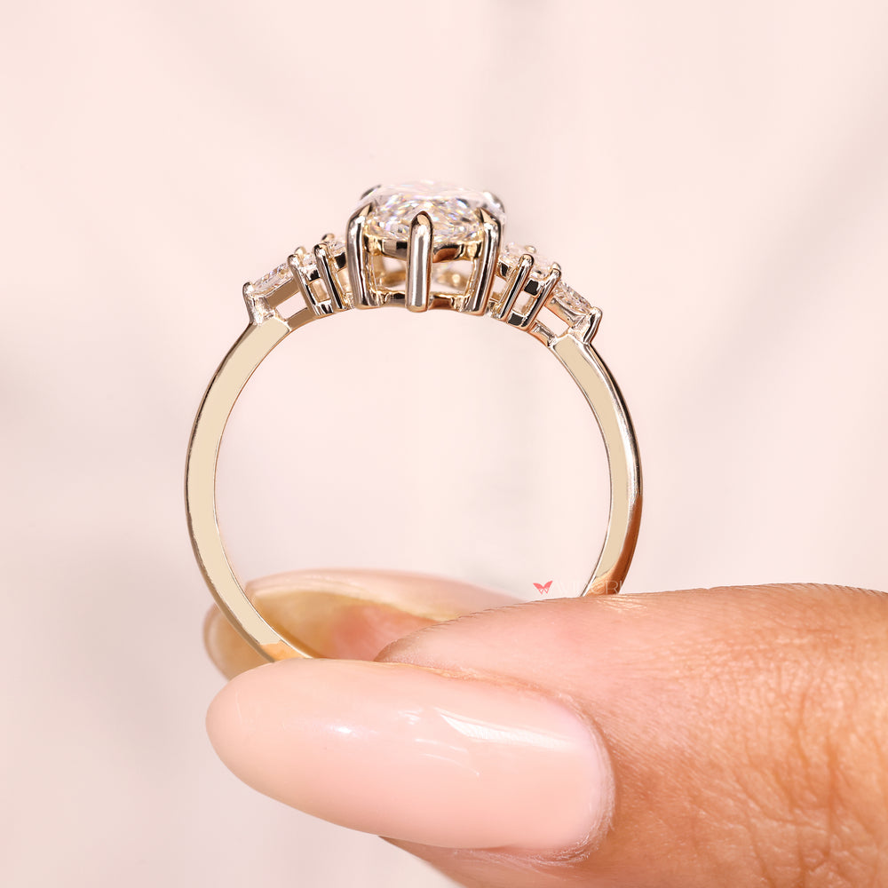 Marquise lab diamond ring with six claw prong design.
