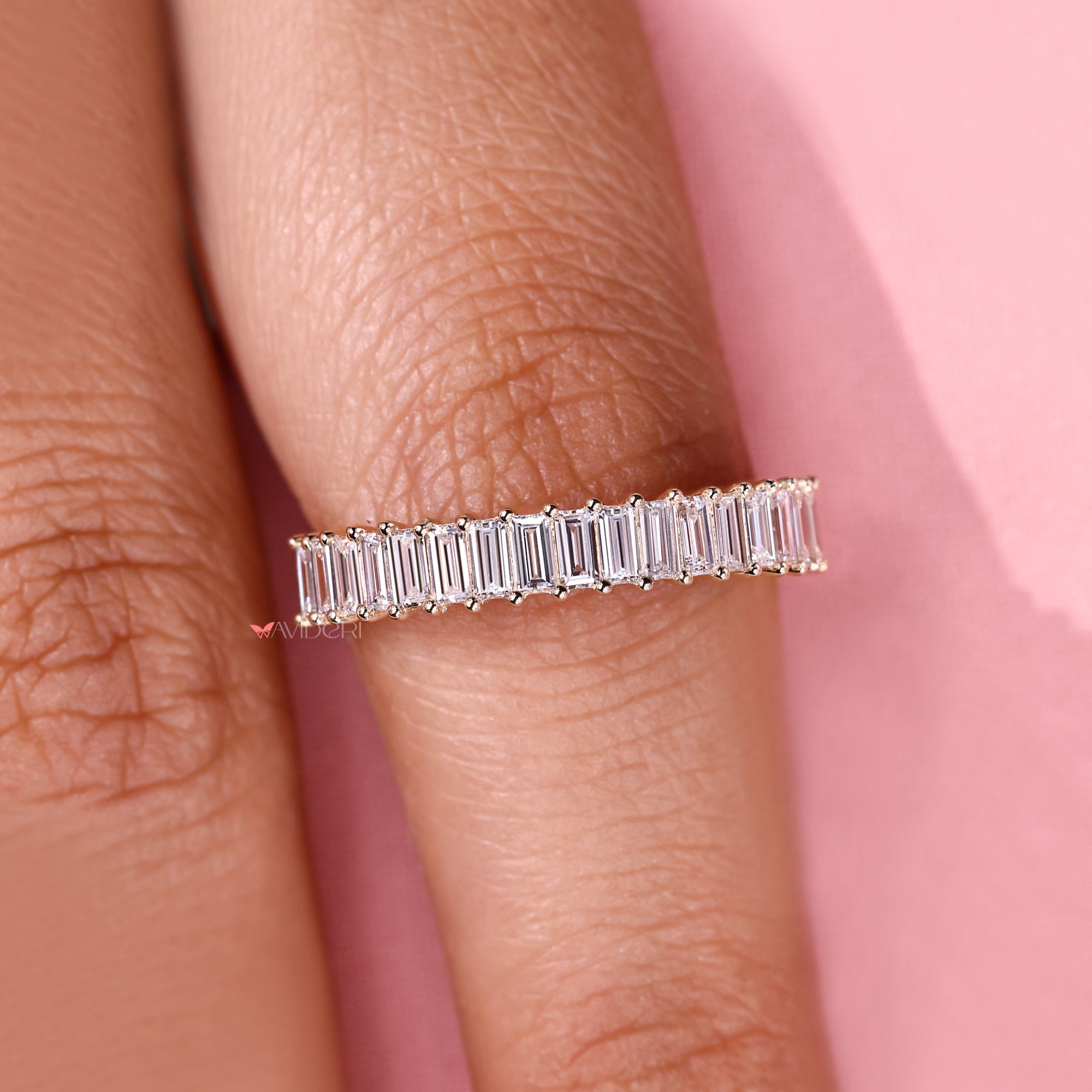 Half eternity band with baguette diamond style.

