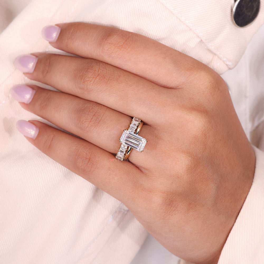 
Baguette cut moissanite band styled with shared prongs and minimalist elegance.