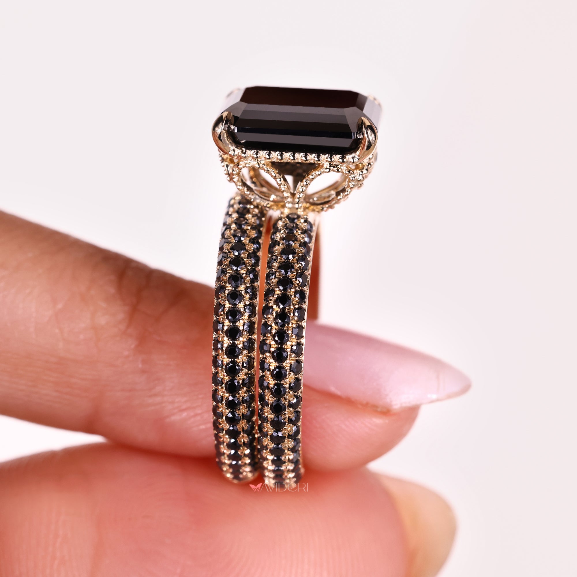 Handmade bridal set featuring an emerald cut moissanite ring for a personalized touch.