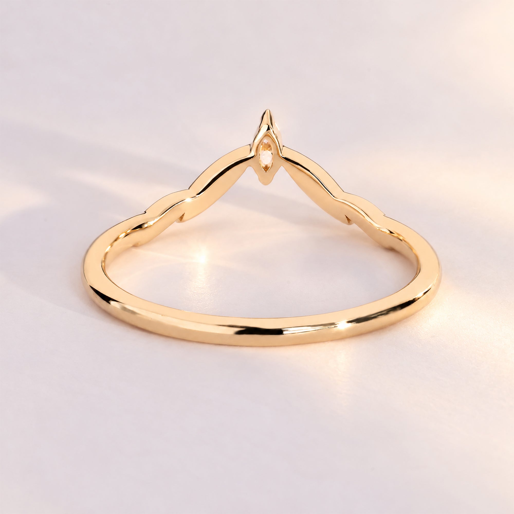 Handmade marquise diamond wedding band with a curve.
