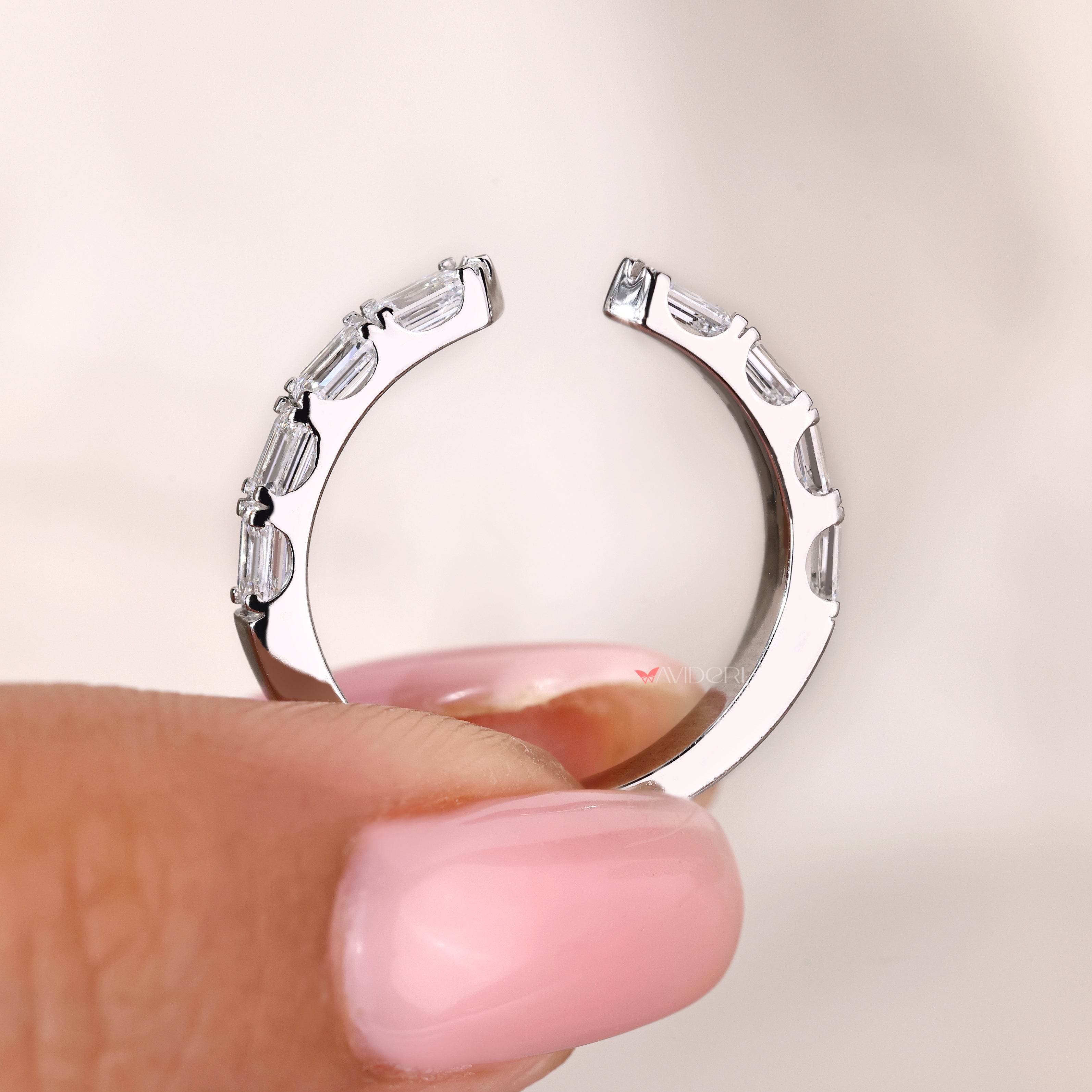 Emerald diamond wedding ring with open gap style setting
