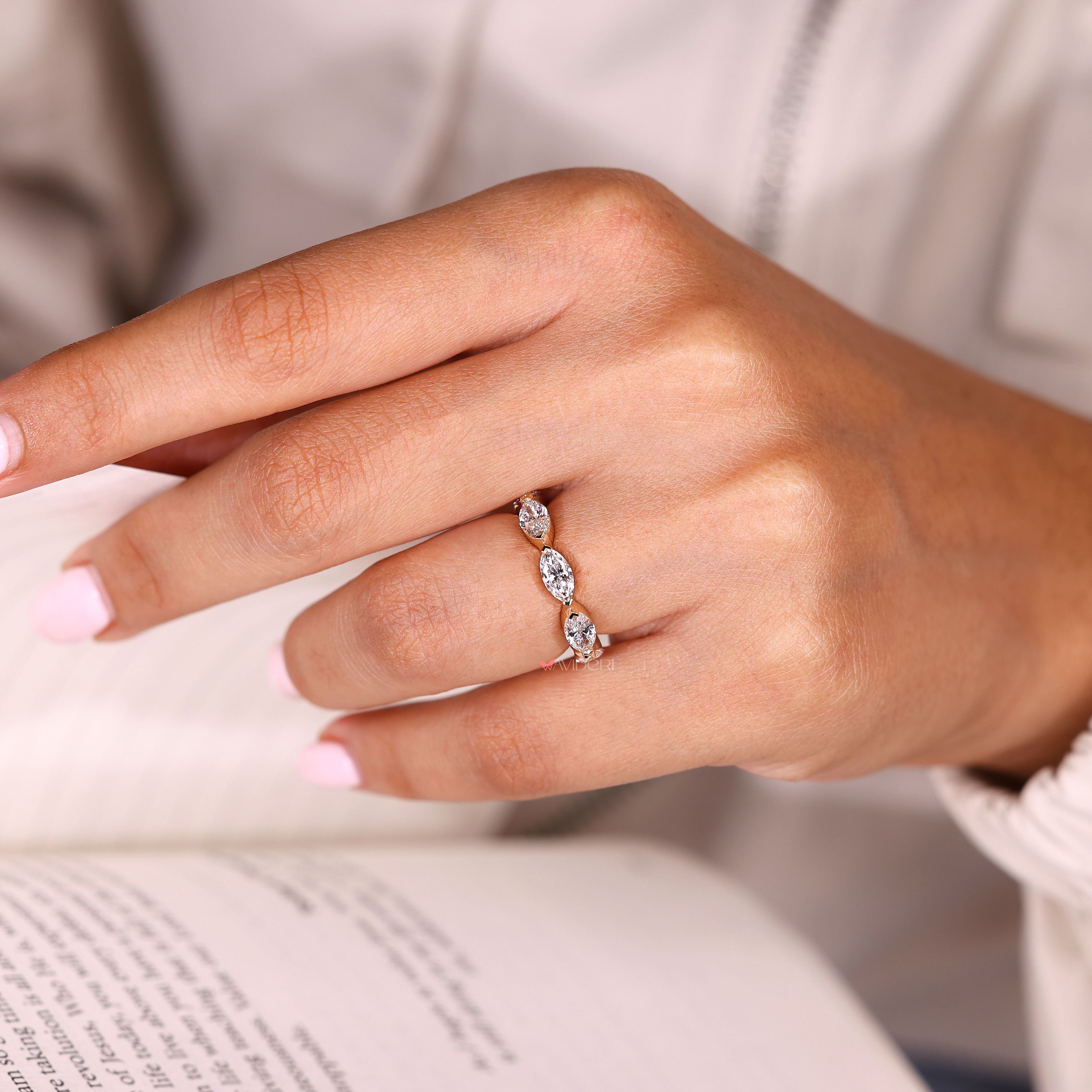 Handmade marquise eternity band with secure V prong setting
