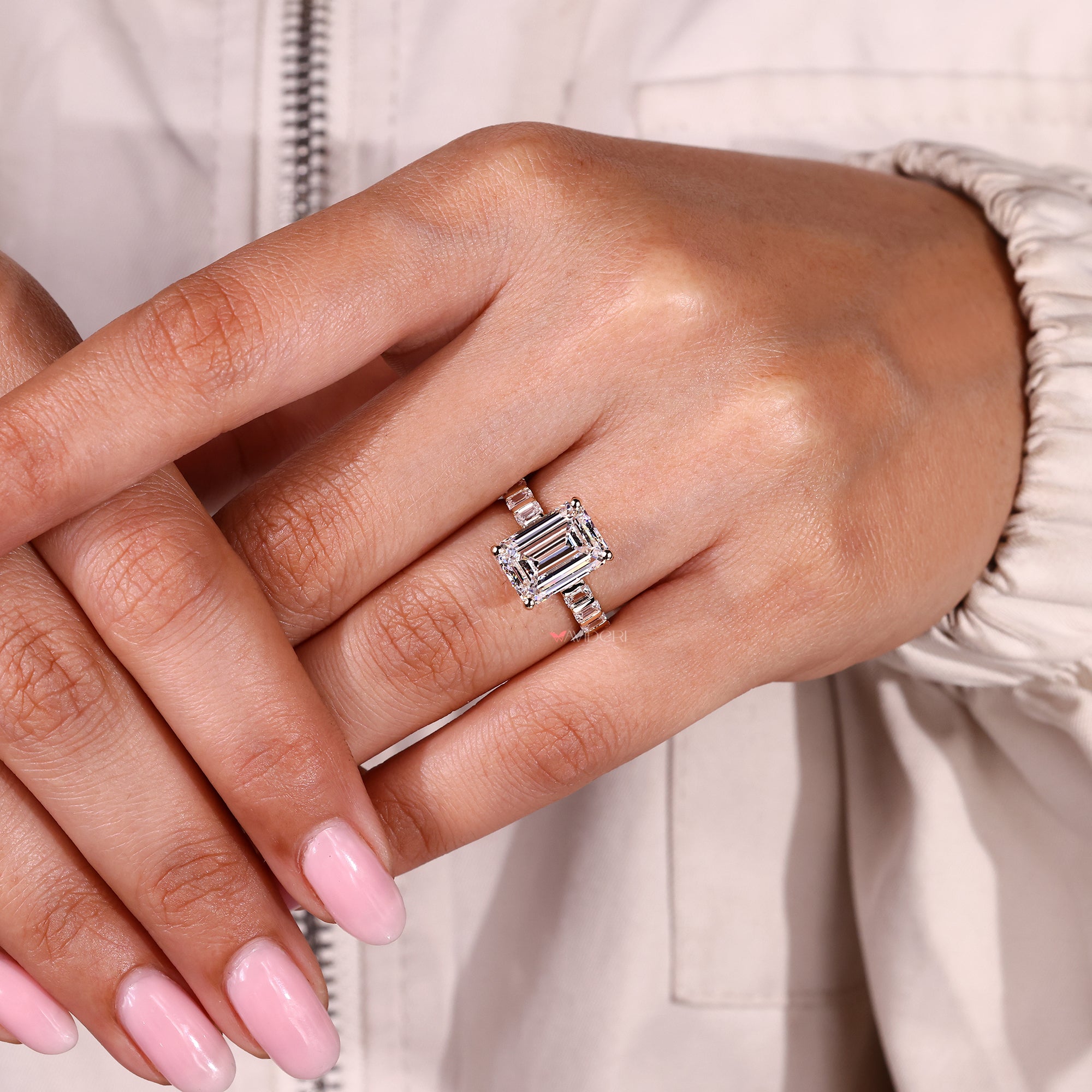 Emerald cut ring with emerald cut pave band style.
