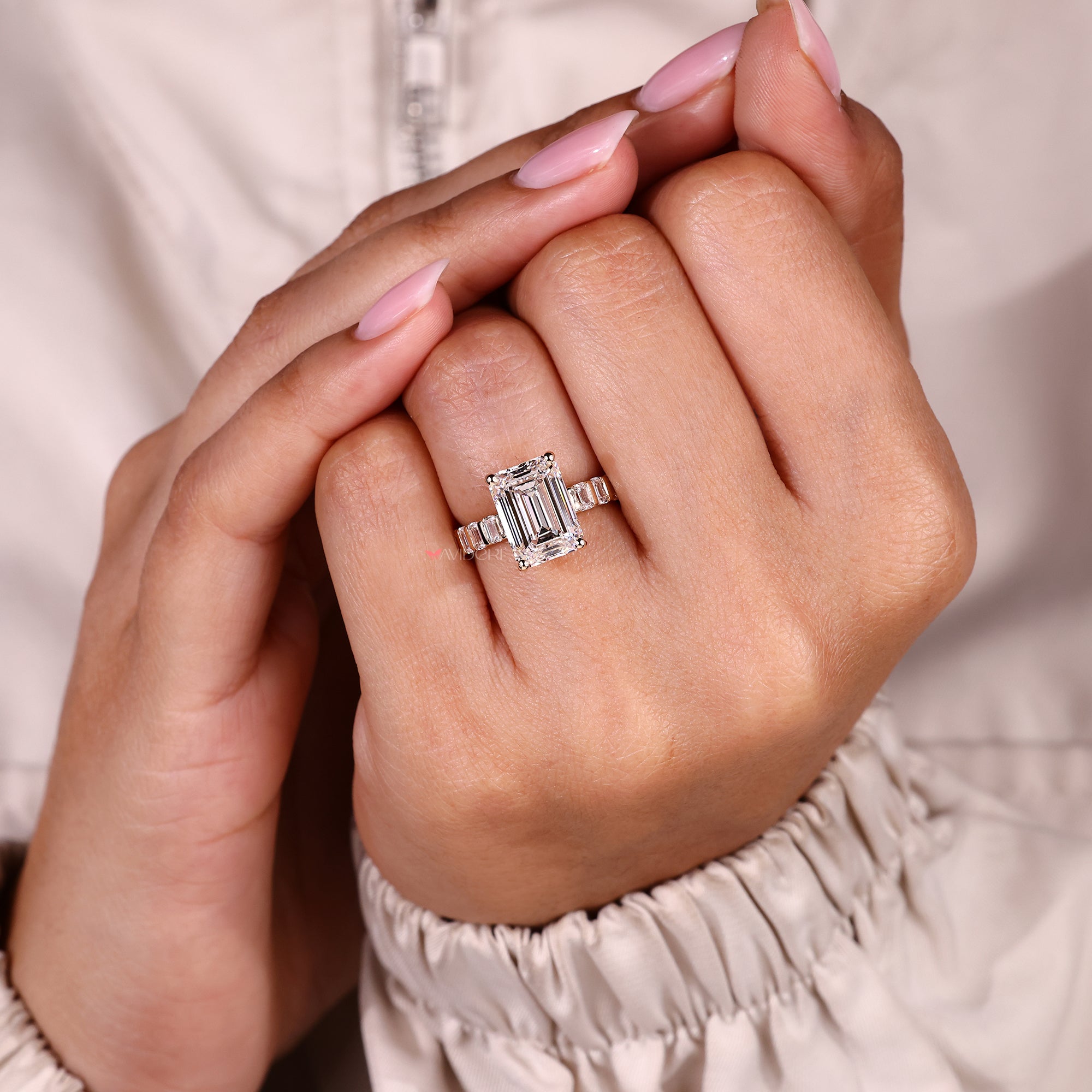 Handmade emerald cut diamond ring with modern pave.
