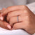 Tapered baguette side stone in 3 stone wedding band.