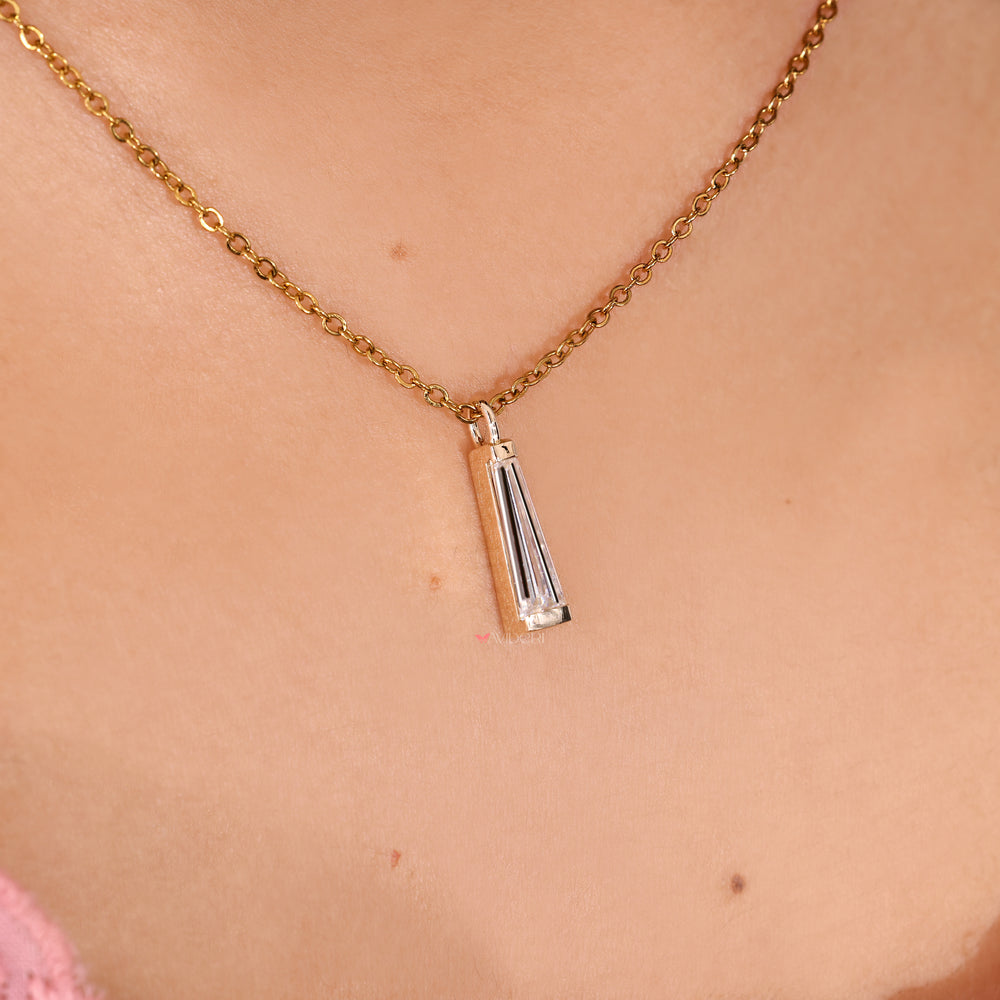 Handmade solitaire pendant with tapered baguette moissanite stones.
