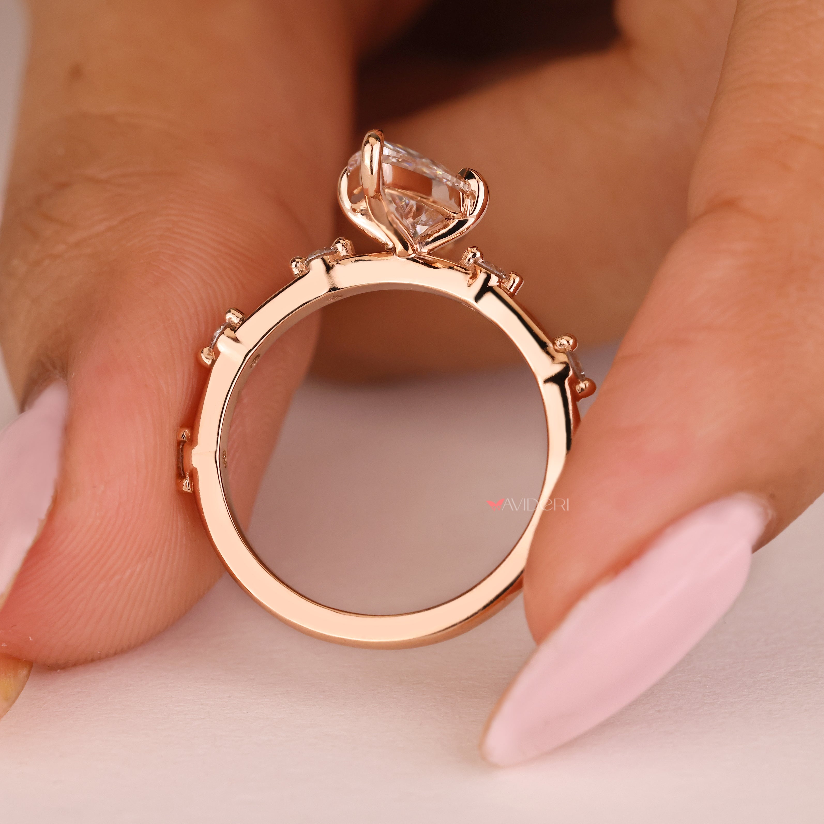 Lab grown marquise engagement ring with pave diamond accents

